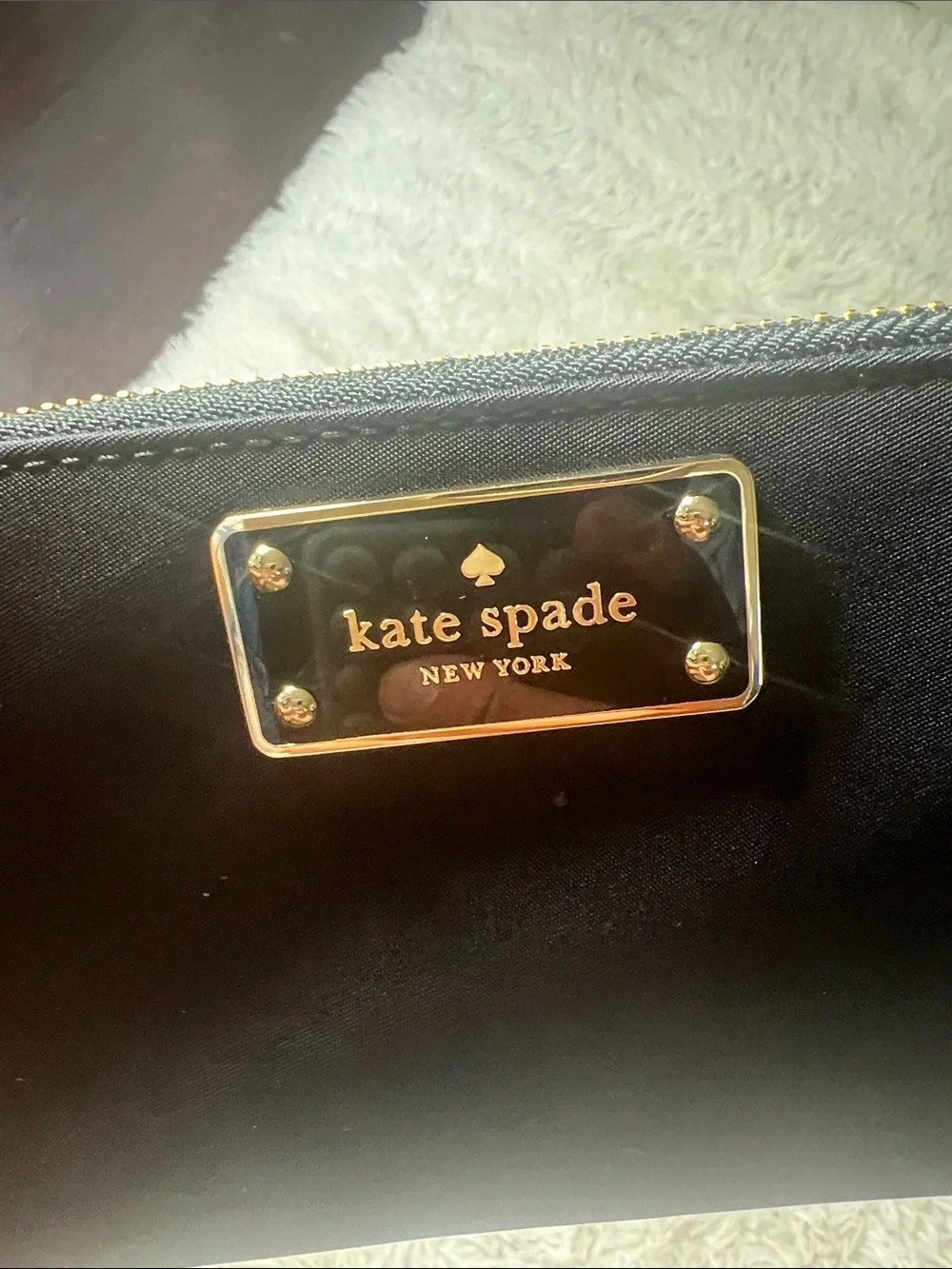 kate spade Black Zip-Around Logo Plate Wallet